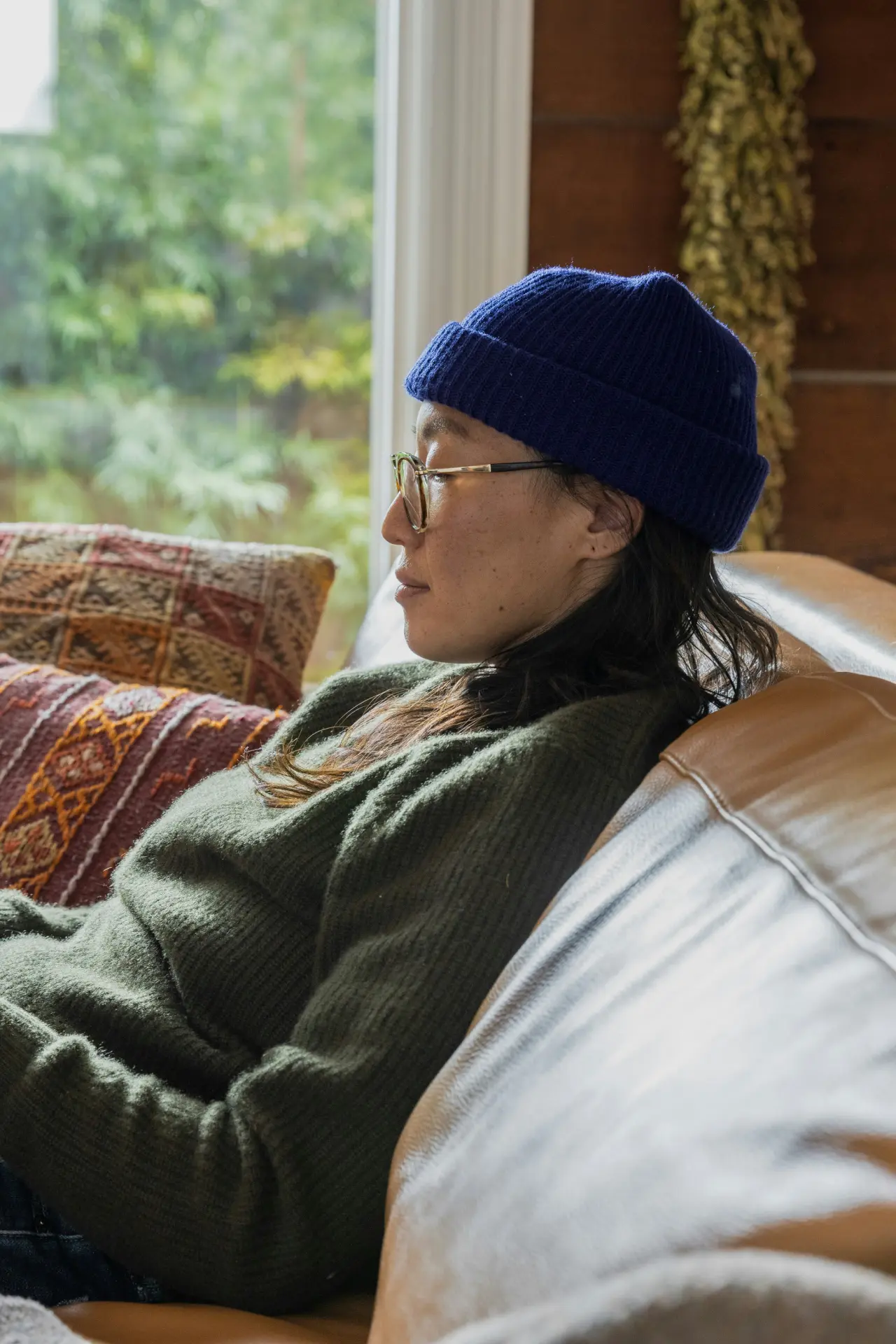 Professional analyzing data on a laptop, preparing a business report